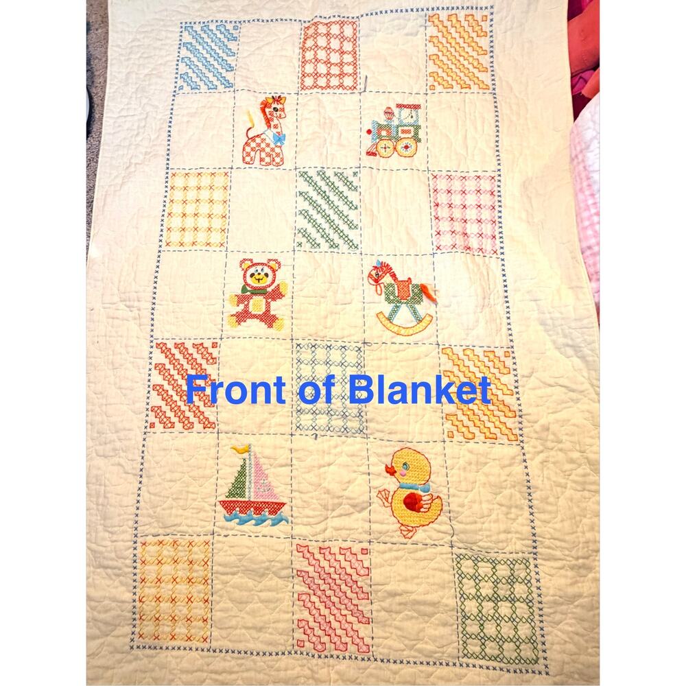 yellow handmade cross stitch baby blanket dated nuresery